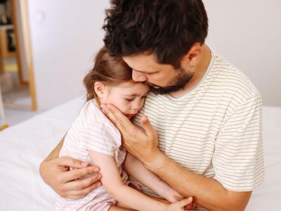 Man holding young girl